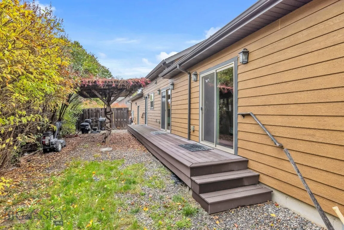 Opposite side of yard has slider access from both bedrooms