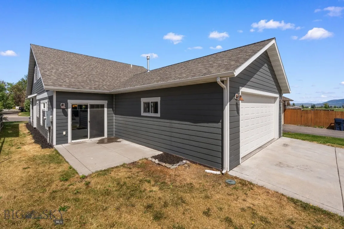 Alley access exterior view w/ back
patio, parking and 2 car garage