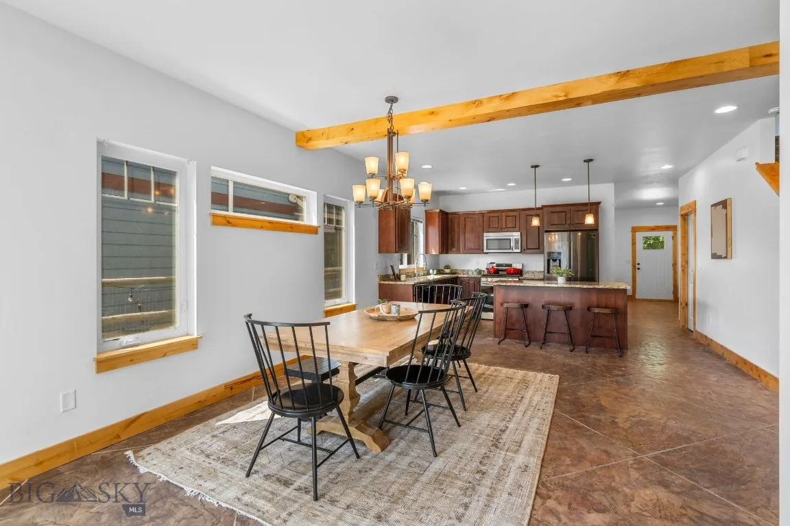 Kitchen and dining toward front entry and living room