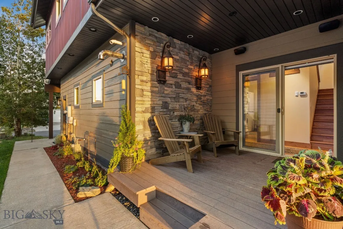 View of covered porch and flower beds