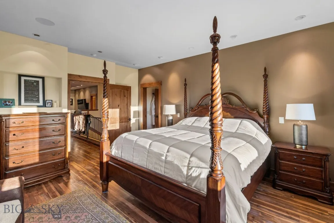 Primary suite with large walk-in closet and balcony views of park
