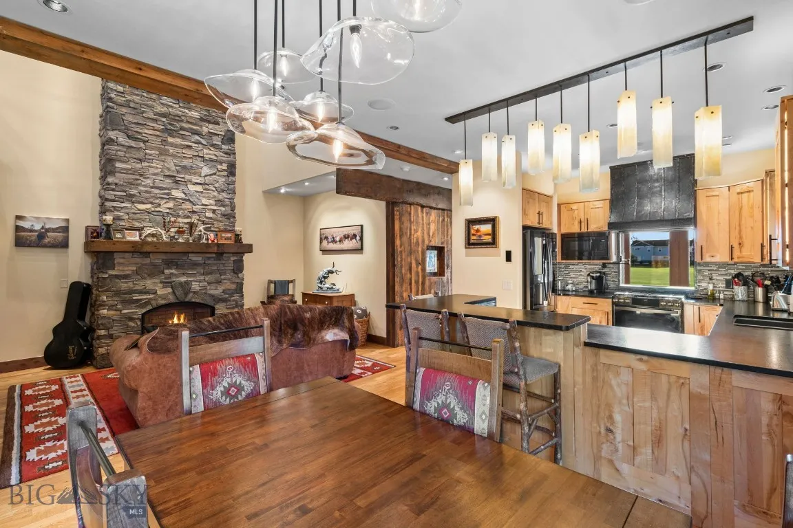 Open and inviting dining and living area with custom finishes throughout