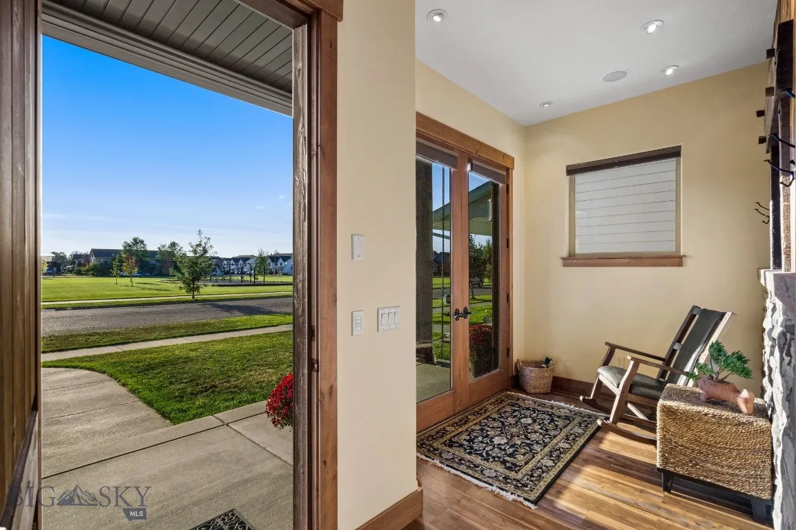Entryway with seating area and heated floors overlooking park