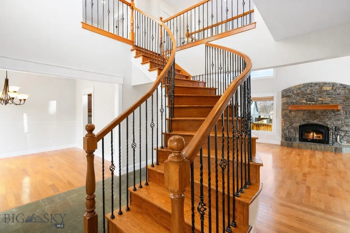 Elegant curved custom entryway staircase