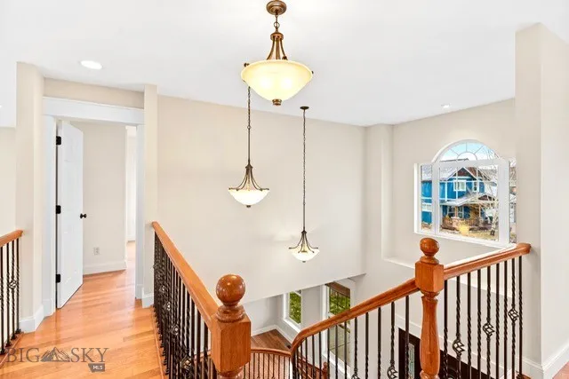 open railed catwalk connects to a private guest bedroom