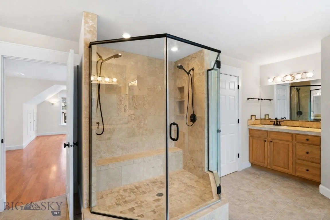 walk-in glass shower with dual showerheads