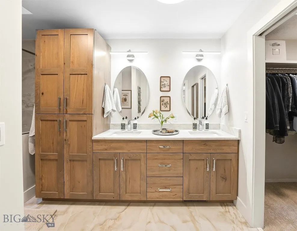 Gorgeous remodeled bathroom with solid surface counters custom cabinetry