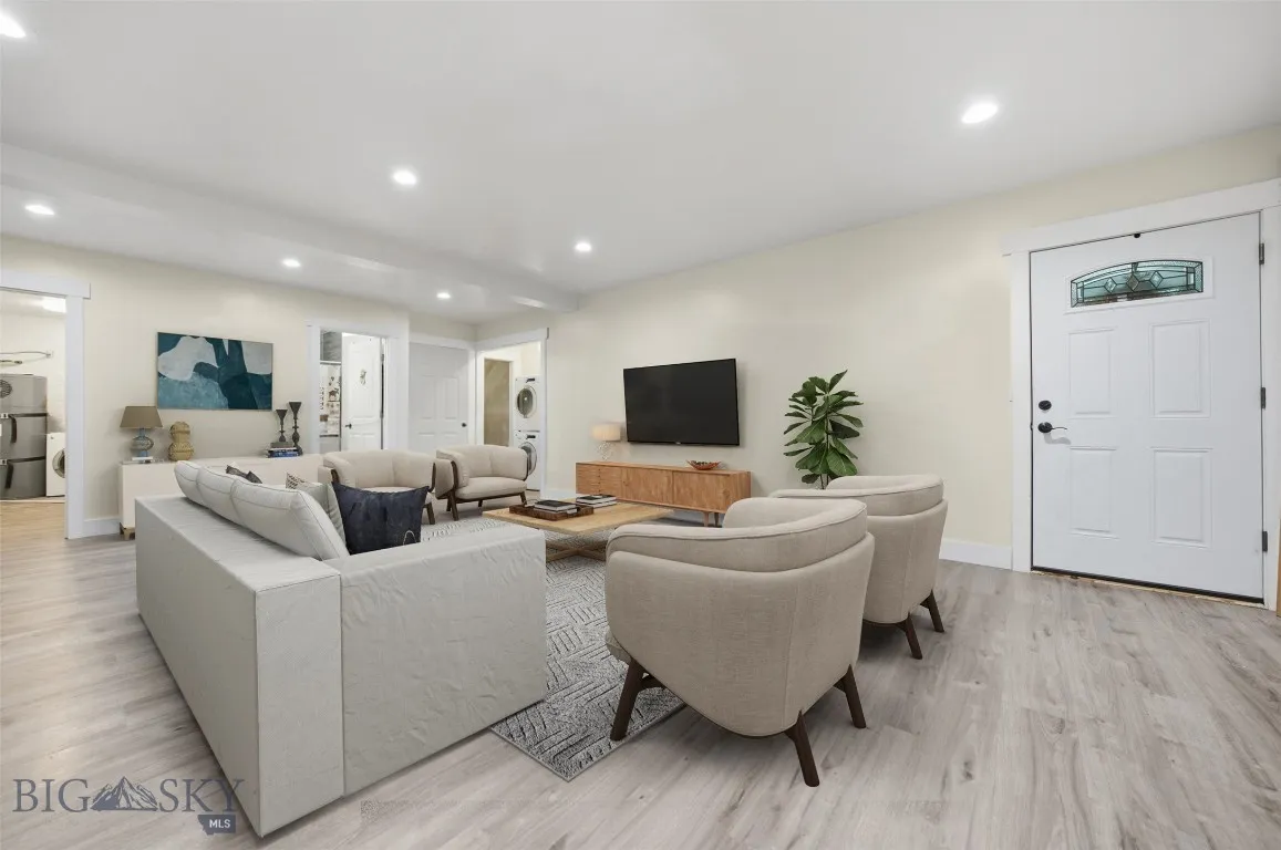 Basement living. This image has been virtually staged. Furniture and décor shown are for illustrative purposes only and do not convey.
