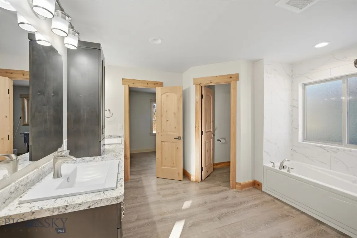 Attached primary bathroom with walk in closet.