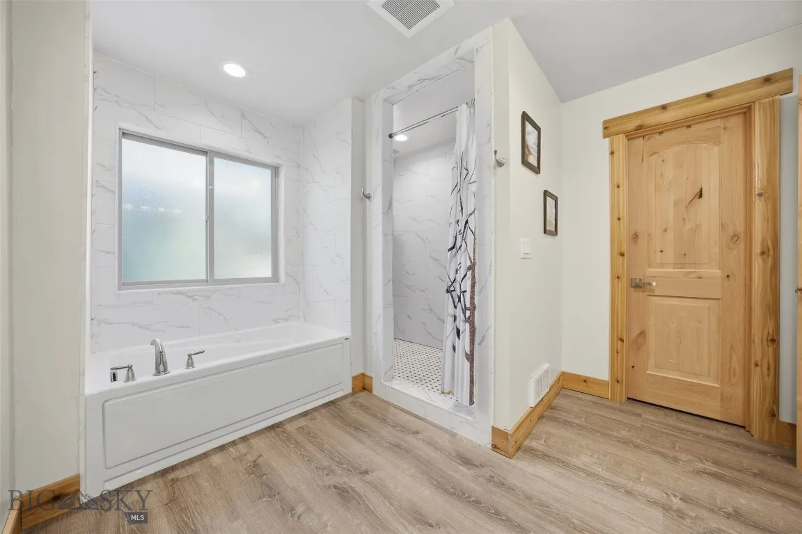Attached primary bathroom with walk in closet.
