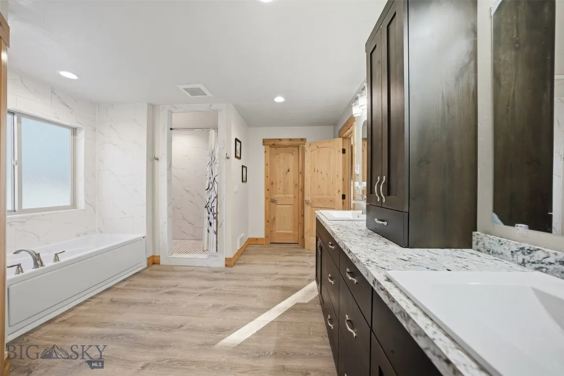 Attached primary bathroom with walk in closet.