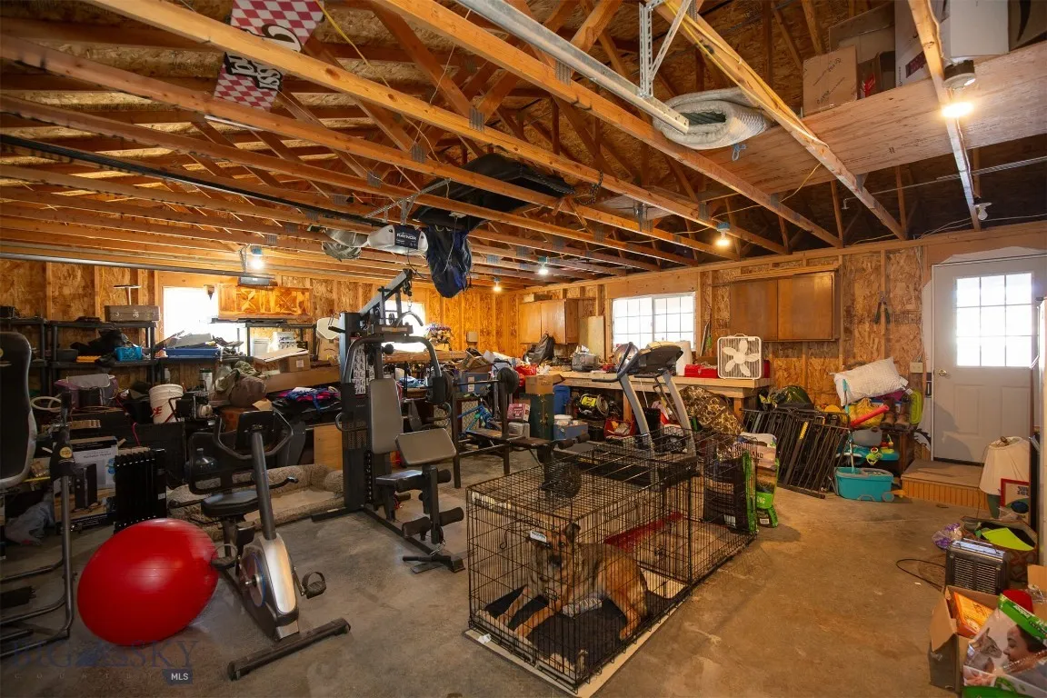 Attached 2-Car Garage with Door Access to Front Porch