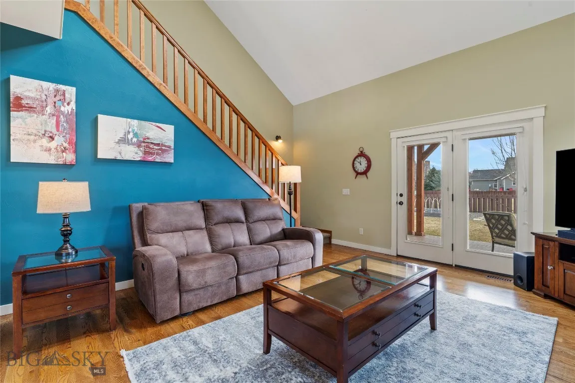 Living room steps out onto covered deck