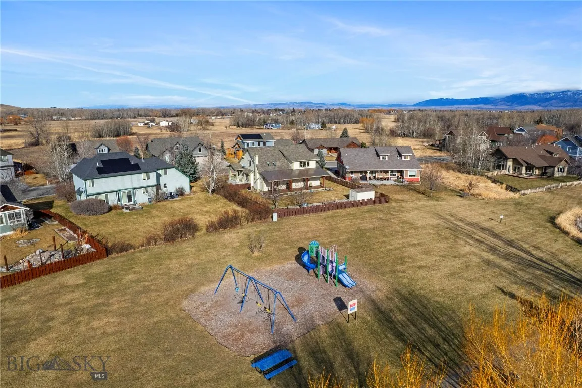 Pocket playground in green space behind the home