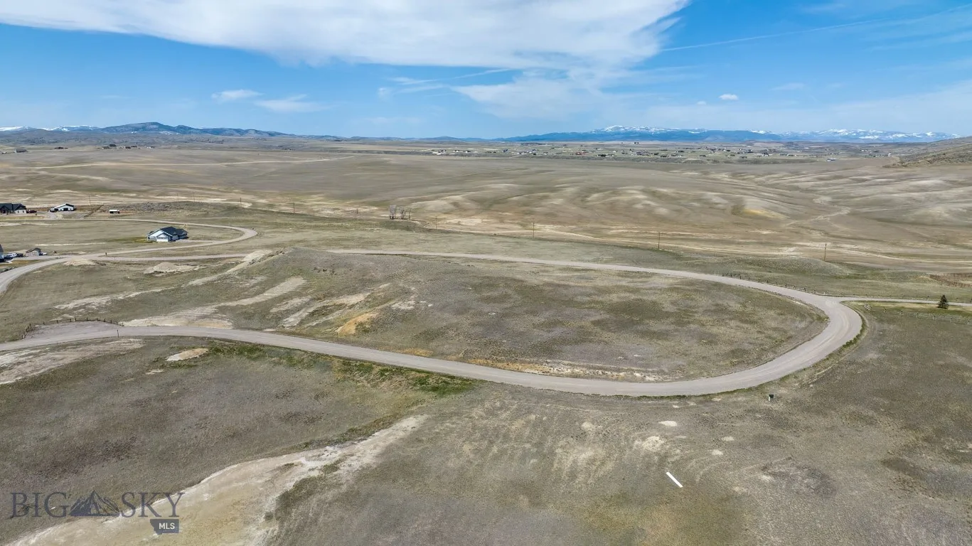 Lot 105 is located on the inside of the horseshoe. It backs to 7.5 Acre Park. The parking area for the park is located on the left of this photo.