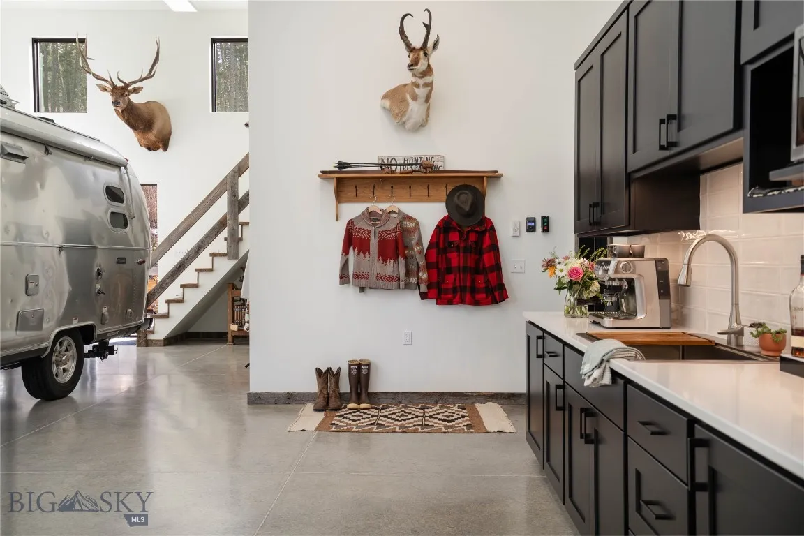 The shop space includes a well-designed kitchenette, making it perfect for entertaining.