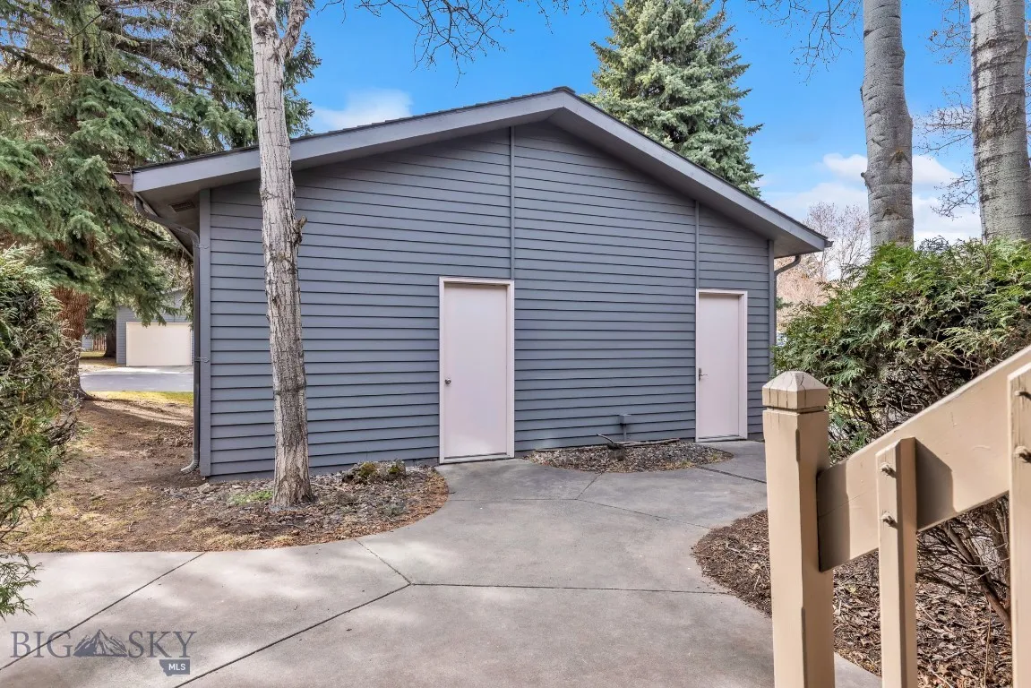 Detached single car garage features attic storage space.