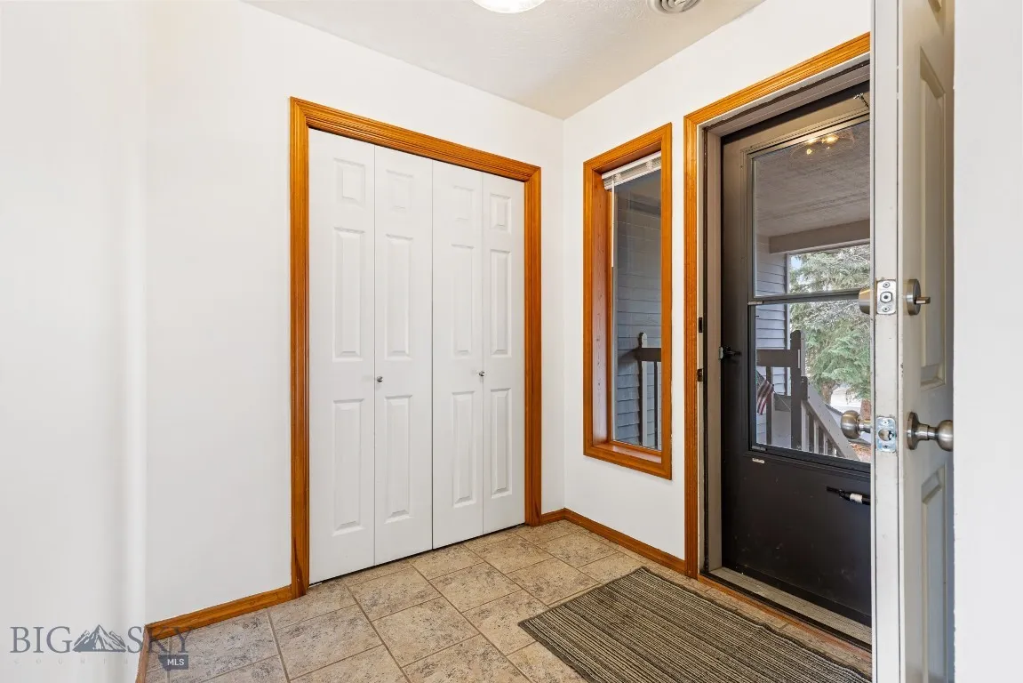 Entry way with coat closet.