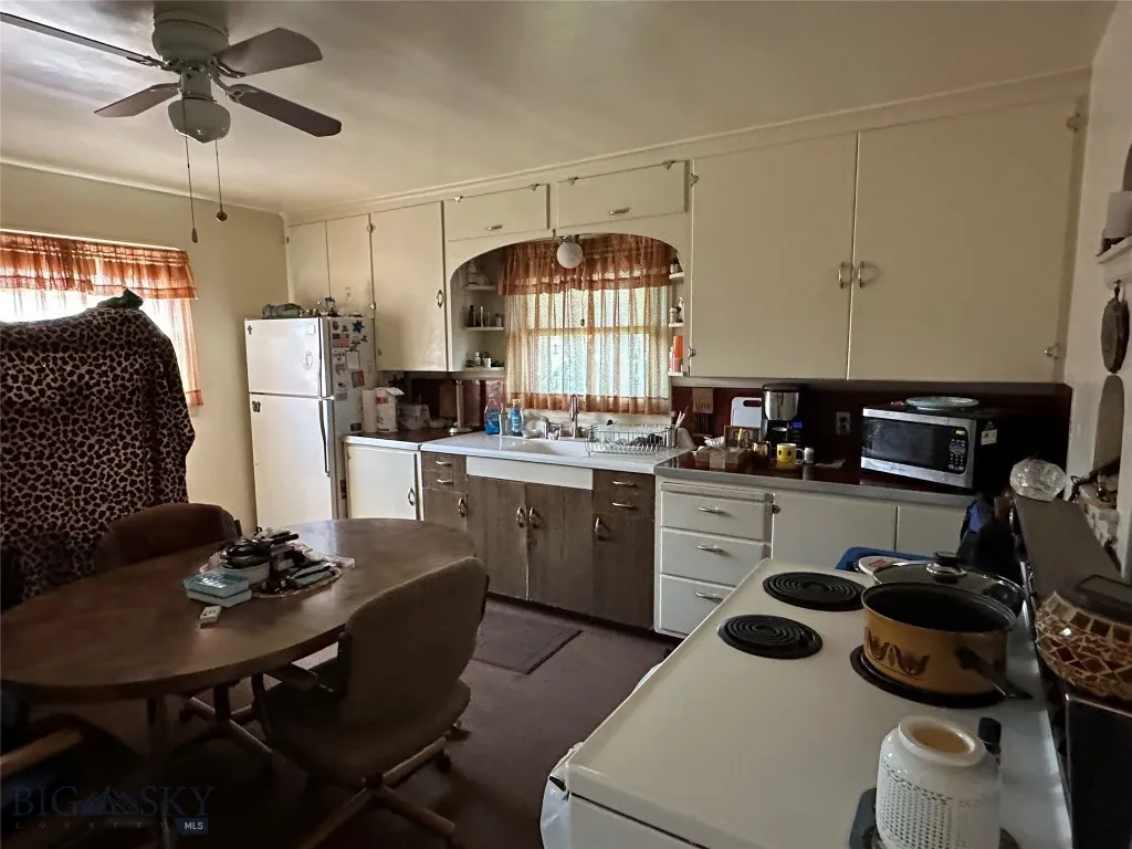 Kitchen with lots of of natural light and a ceiling fan