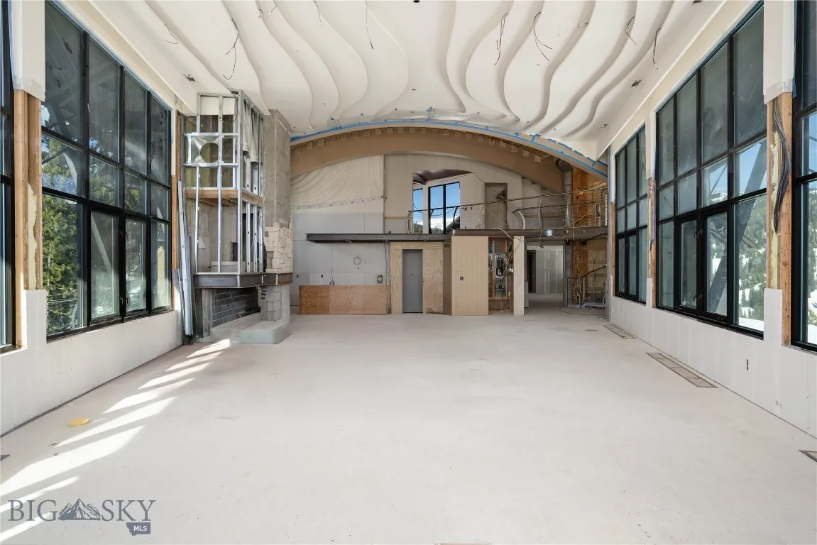 Main living area and kitchen and stone fireplace