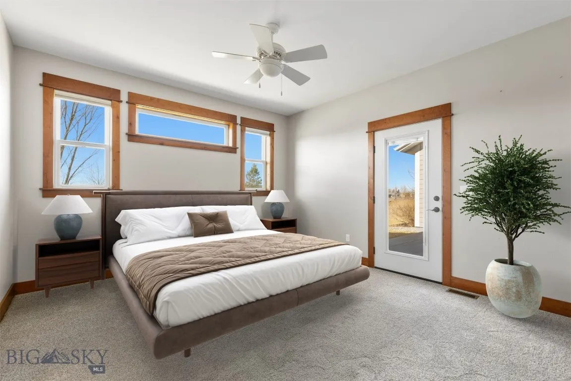 Bedroom 2 has access to patio. Virtually staged.