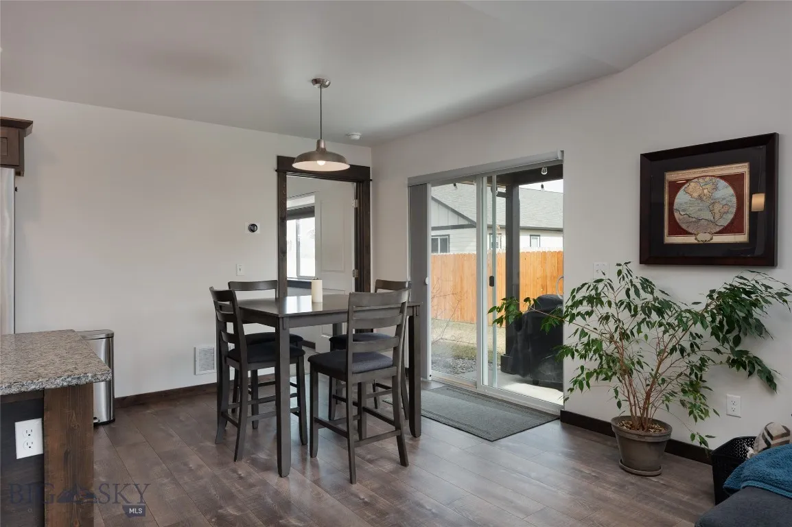 Dining Area w/ Sliding Glass Door to Rear Patio and Yard