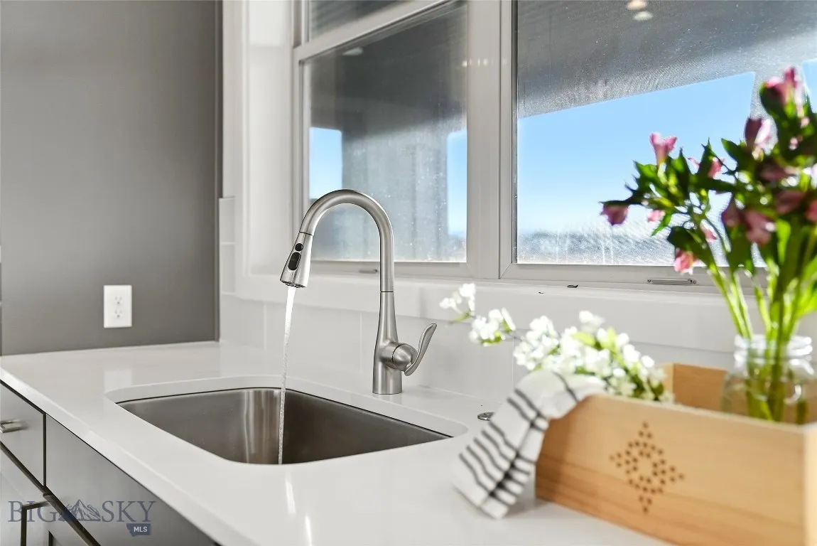 Kitchen sink looking out to the park and big Spanish Peak Mountian views