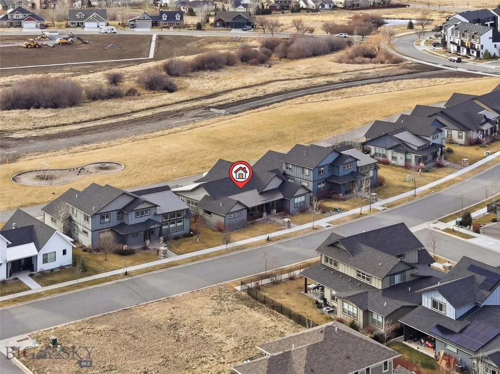 Surrounded by beautiful homes and backing to park space