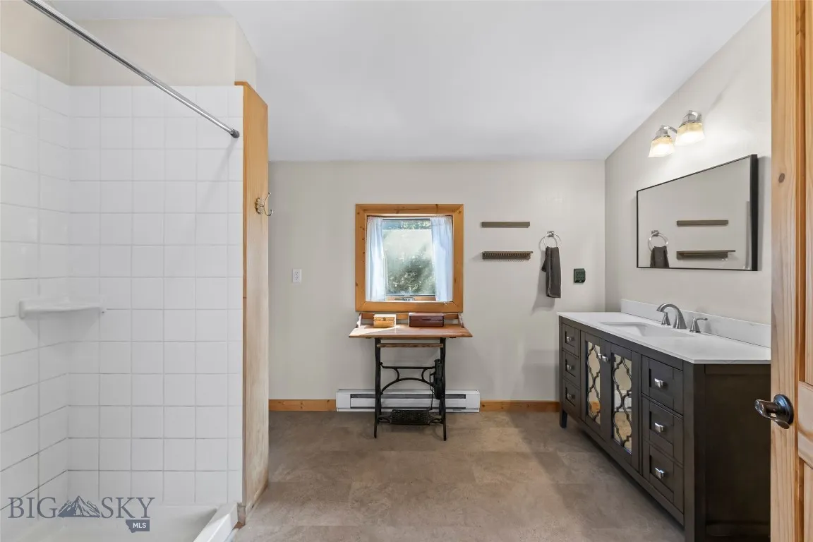 Walk in shower, custom vanity and lighting