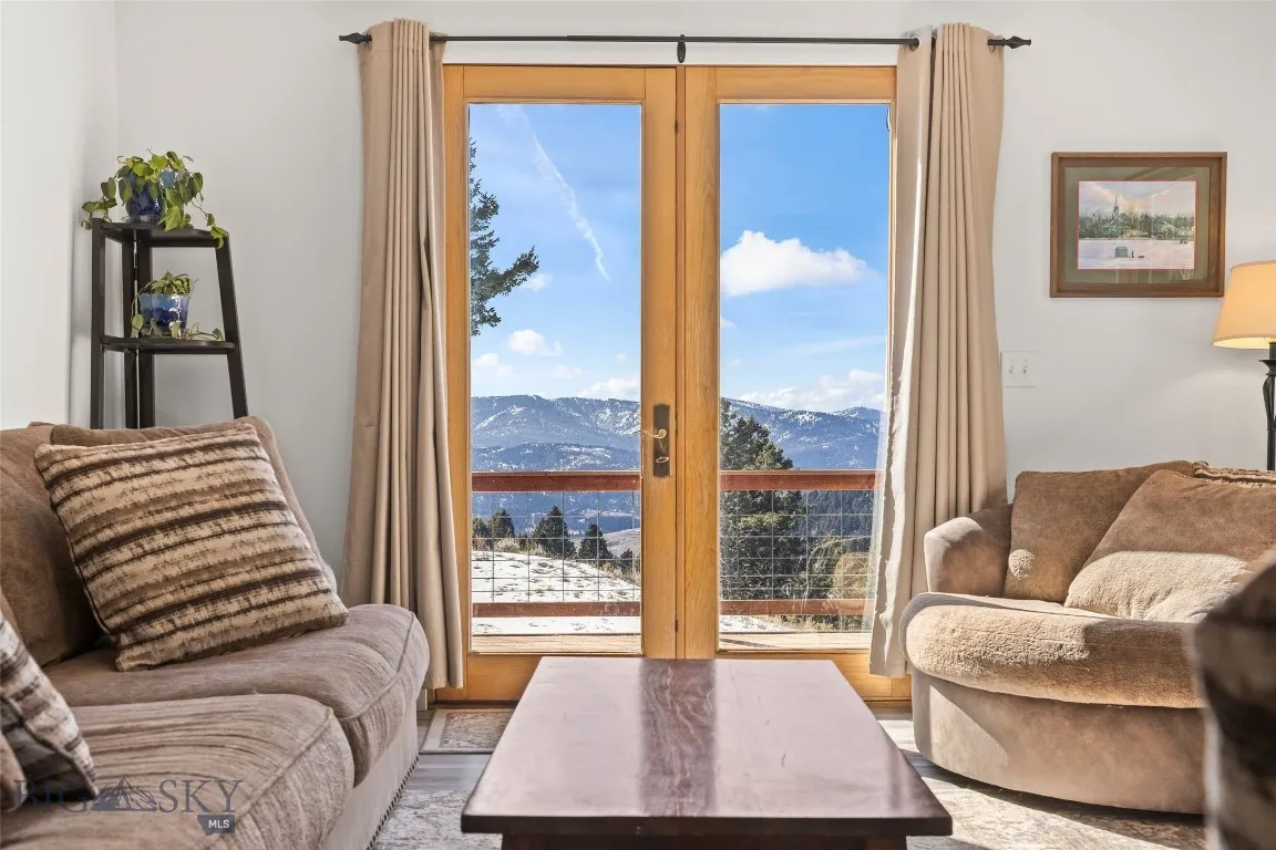 French glass doors  open to the hot tub and big views