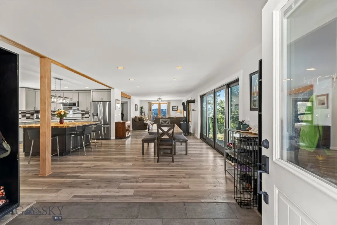 Entry, mud room area, kitchen, dining, half bath, living room and main floor bedroom or office