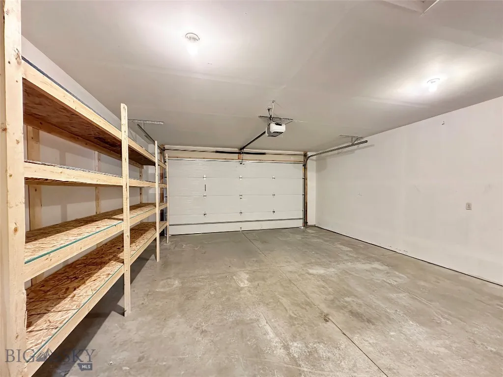 Garage interior with storage​​‌​​​​‌​​‌‌​‌‌​​​‌‌​‌​‌​‌​​​‌​​ shelving