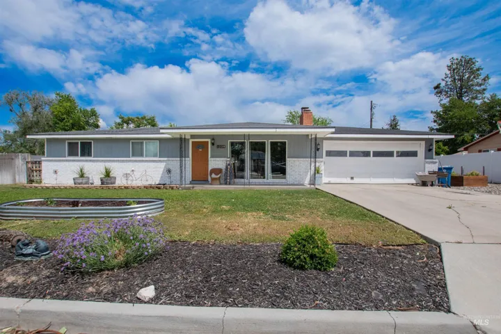 Single-story residence featuring a gray and white exterior facade