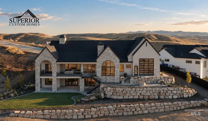 Stone and stucco exterior with multiple balconies and terraces