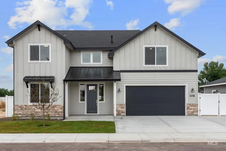 Contemporary exterior with board and batten siding, stone accents, dark asphalt shingle roof, attached two-car garage, and a covered front entry