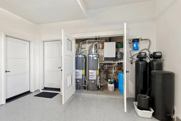 Utility closet with dual water heaters and water filtration system