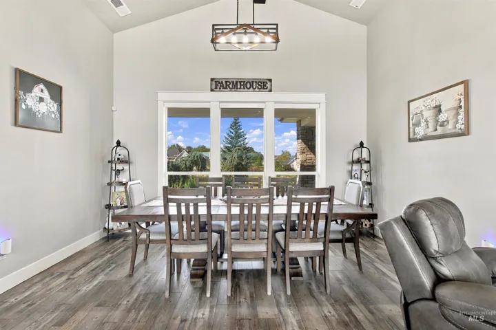 Vaulted ceilings, wood-finish flooring, and large windows