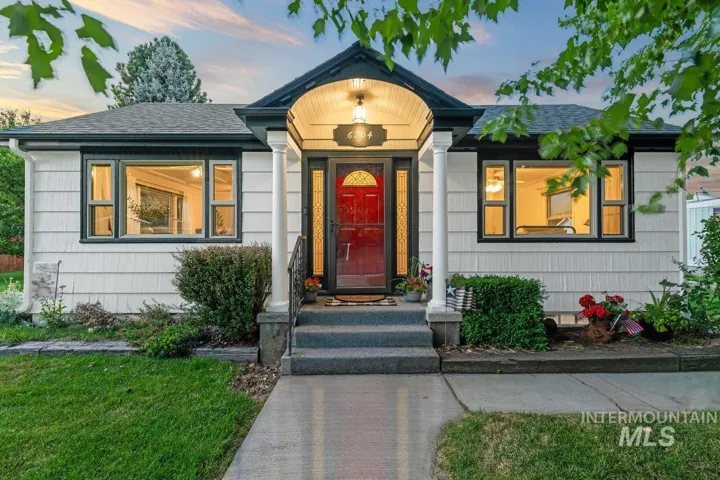 View of front of home featuring a shingled roof