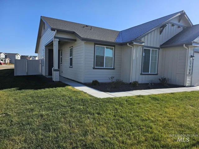Light-toned exterior siding with dark trim accents