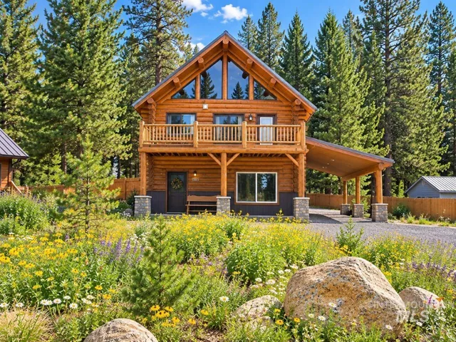Log-style exterior with an A-frame roof and prominent window gables