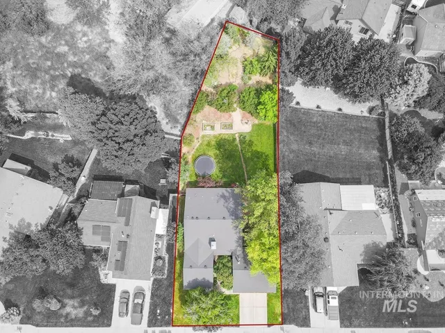Expansive property featuring a substantial green lawn, mature trees, and a terraced upper yard...Bring your creative ideas to make this your own private oasis!