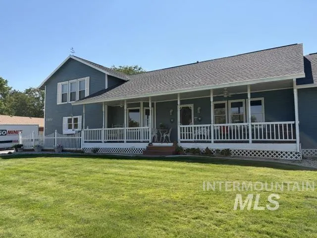 Expansive front lawn with a beautiful front porch