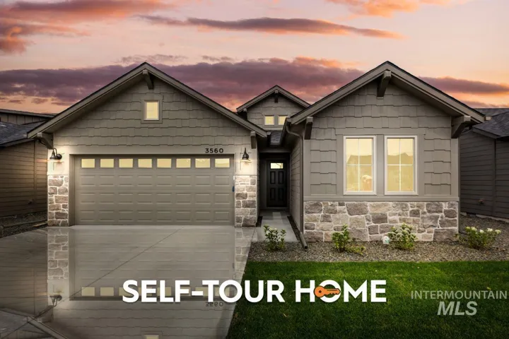 Contemporary Craftsman home featuring stone and horizontal siding accents, an attached garage with window inserts, multiple gables, and exterior wall lanterns