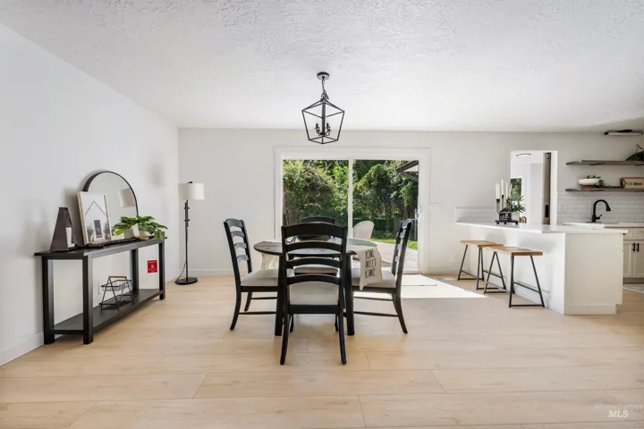 Large dining room with sliding glass door to patio