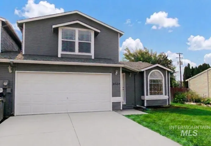 Gray exterior siding with white trim