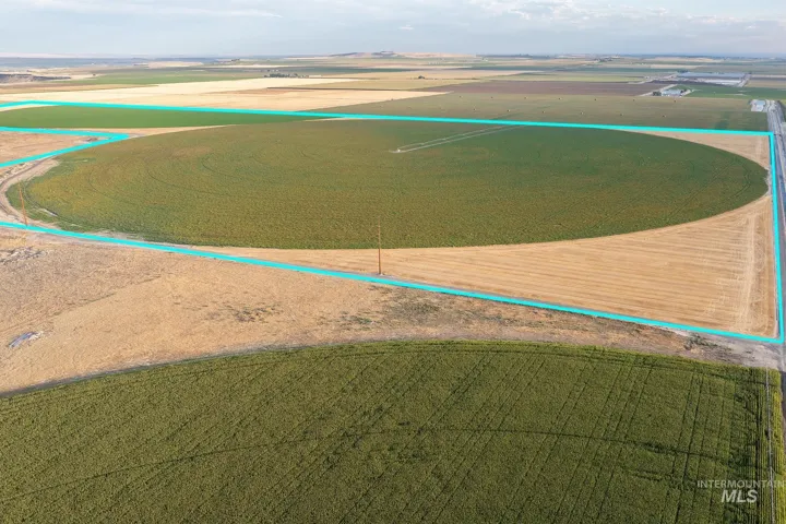 Aerial view of sparsely populated area featuring property parcel outlined