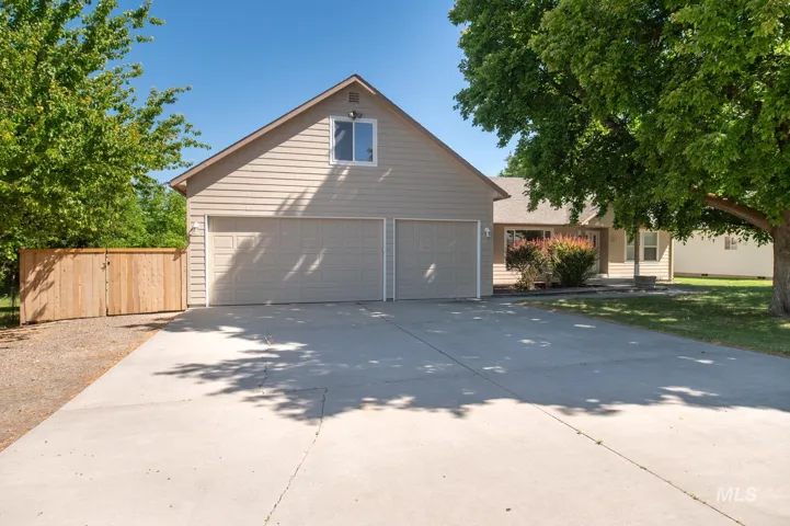 Two-car garage with overhead doors and a concrete driveway