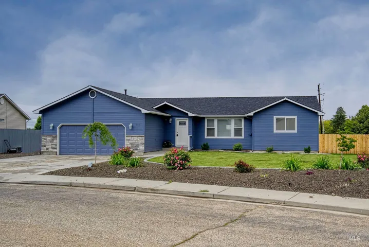 Single-story residence featuring blue siding, stone accents, and an attached two-car garage