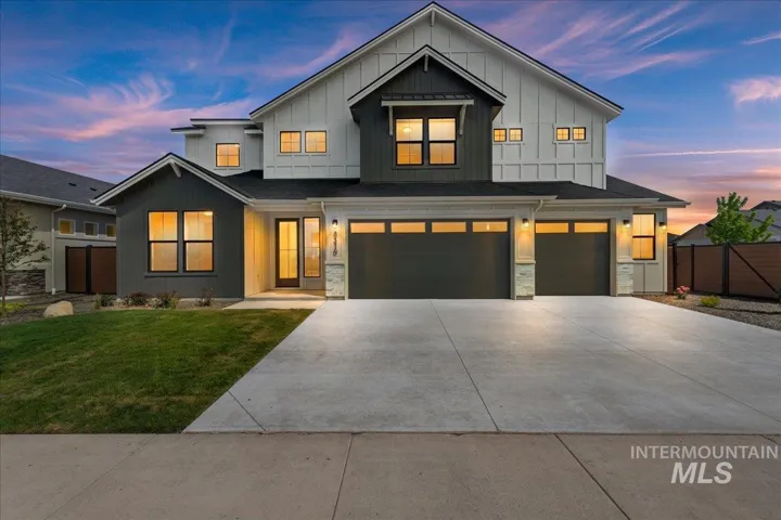 Contemporary two-story residence featuring a striking dark gray and white exterior