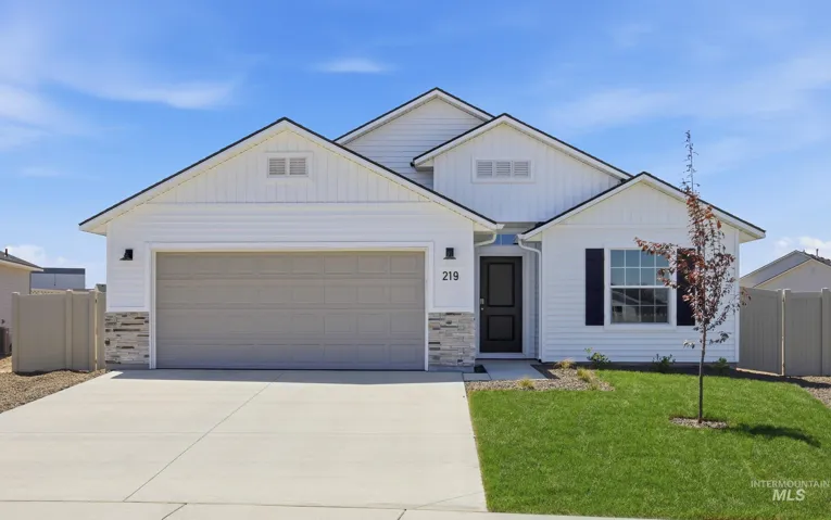 Crisp white siding exterior with stone accent detailing
